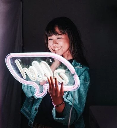 Young girl stoked with new led neon sign