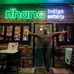 Khana Indian restaurant green and cool white neon sign